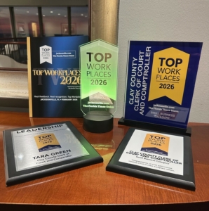 Top Workplace awards arranged on a table at the event.